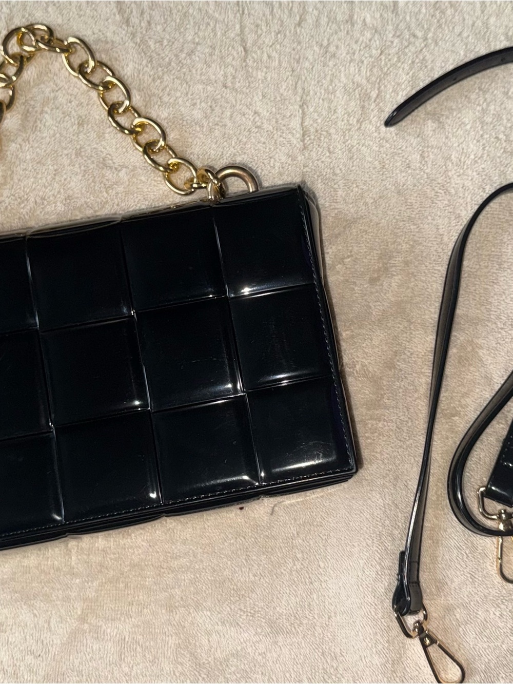 Black bag with gold chain and adjustable strap